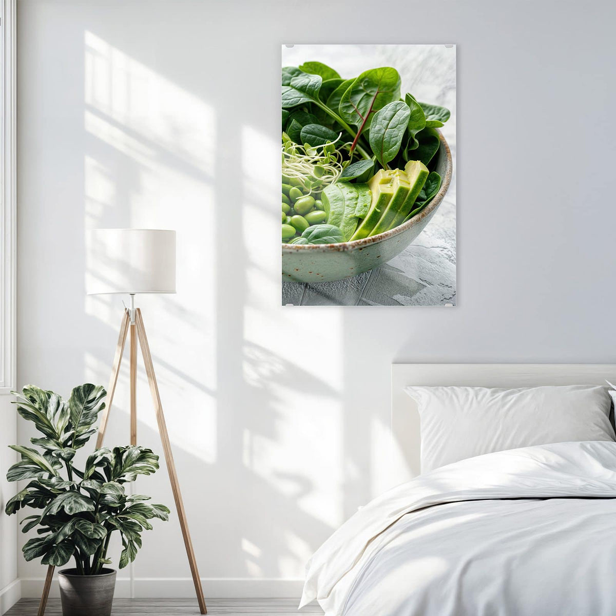 Glasbild Salat mit Avocado an der Wand – Grüne Schale mit Spinat, Gurke, Edamame, Radieschen und Sprossen, halbe Avocado und Limette daneben