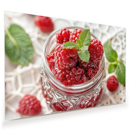 Wandbild mit dem Motiv Glas mit Himbeeren