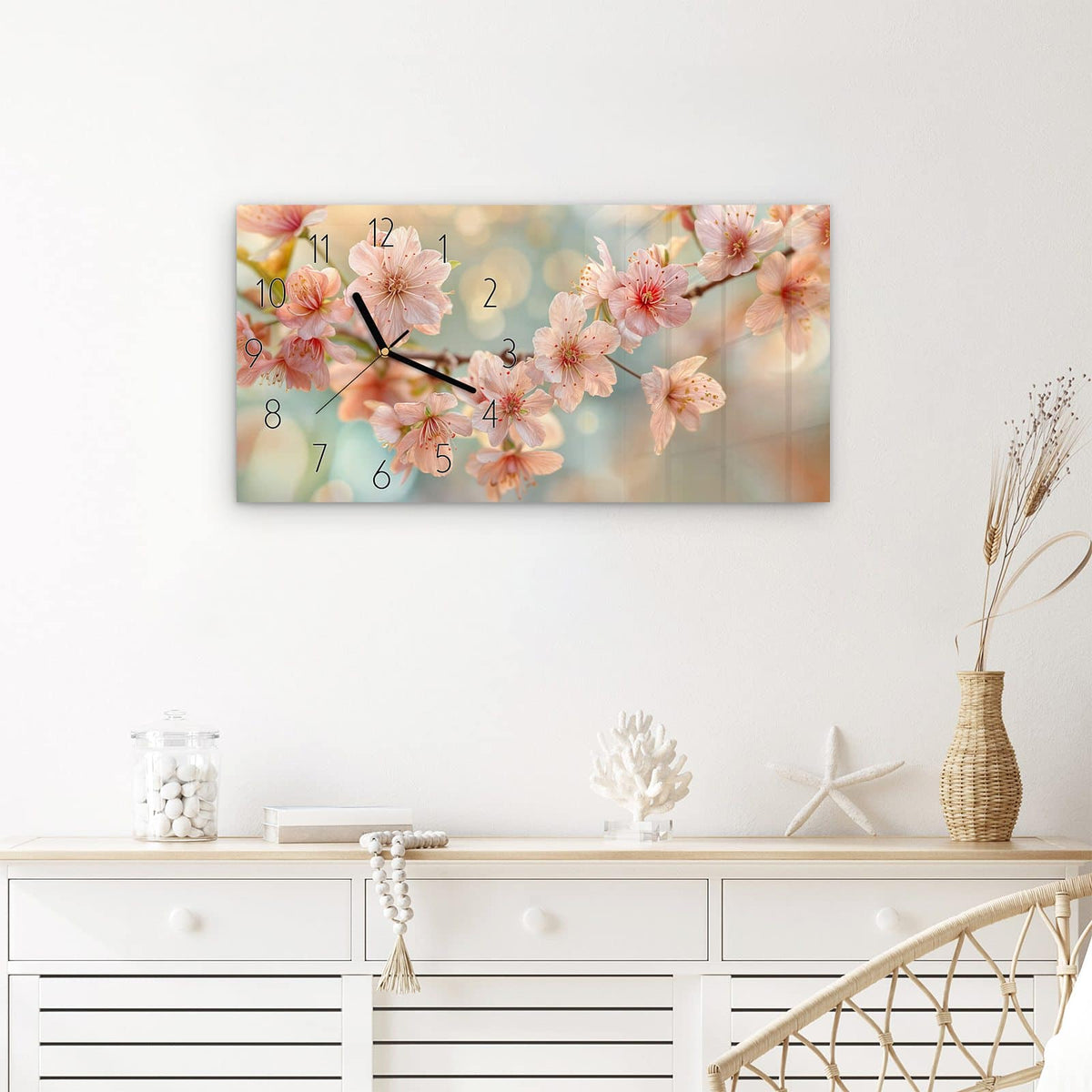 Wanduhr Kirschblütenzauber aus Glas – Querformat 60 × 30 cm – Kirschblüten vor grünblauem Bokeh