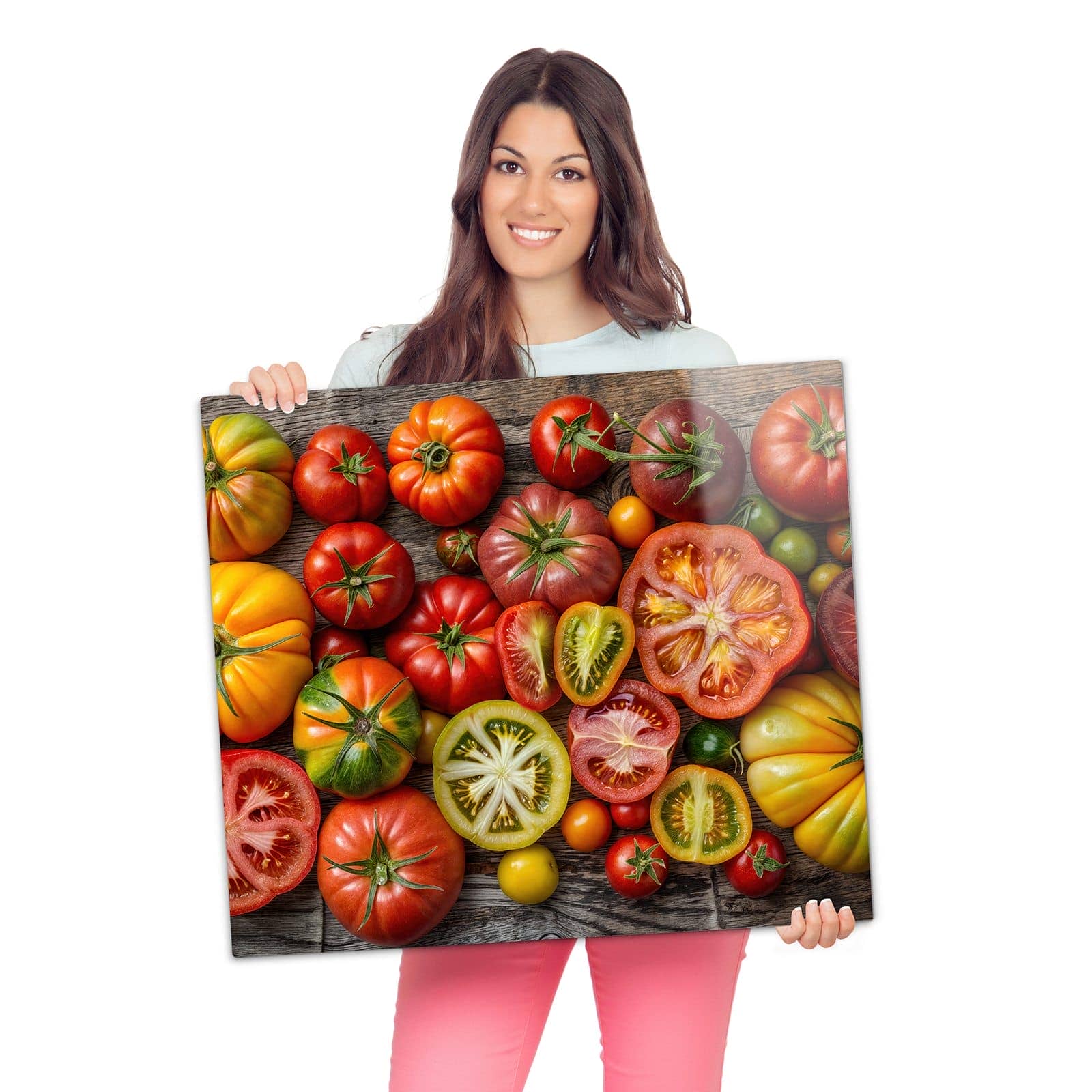 Herdschutzplatte mit Verschiedene Tomaten-Motiv wird zur Größendarstellung gehalten