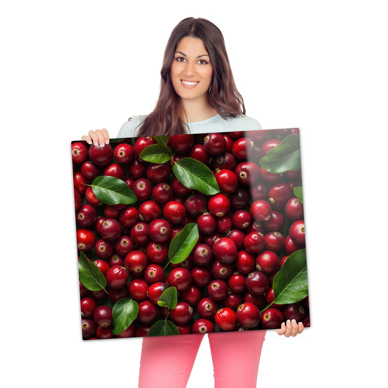 Herdabdeckplatte mit Frische Preiselbeeren-Motiv wird zur Größendarstellung gehalten