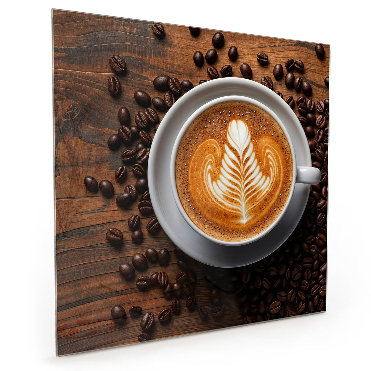 Küchenrückwand aus Glas im quadratischen Format: Tasse von oben mit blattförmiger Latte Art, ringsum Kaffeebohnen auf dunklem Holz #grösse_50 x 50 cm #grösse_60 x 60 cm #grösse_40 x 40 cm