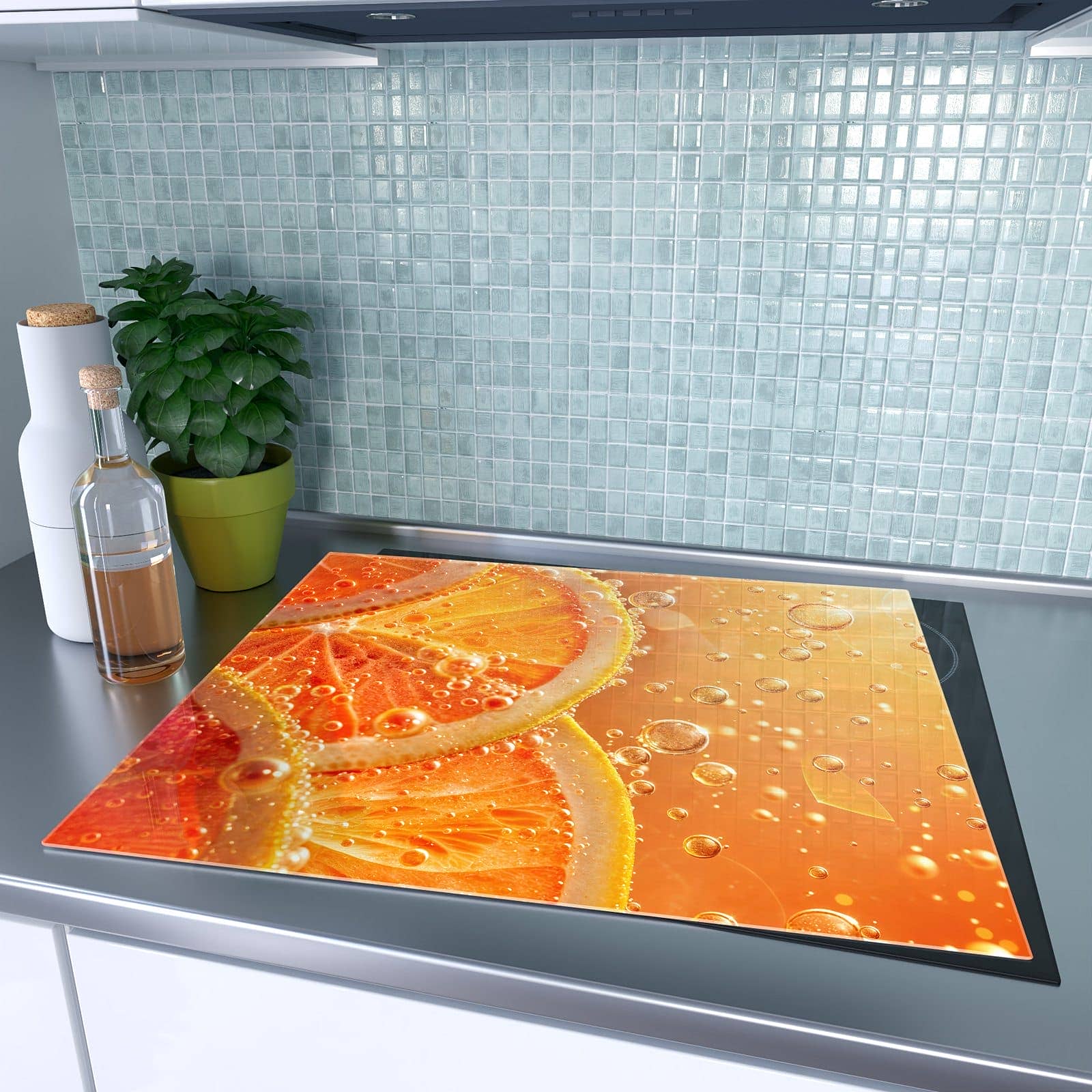 1-teilige Abdeckplatten für Ceranfeld mit Spritzige Orange-Motiv auf dem Ceranfeld