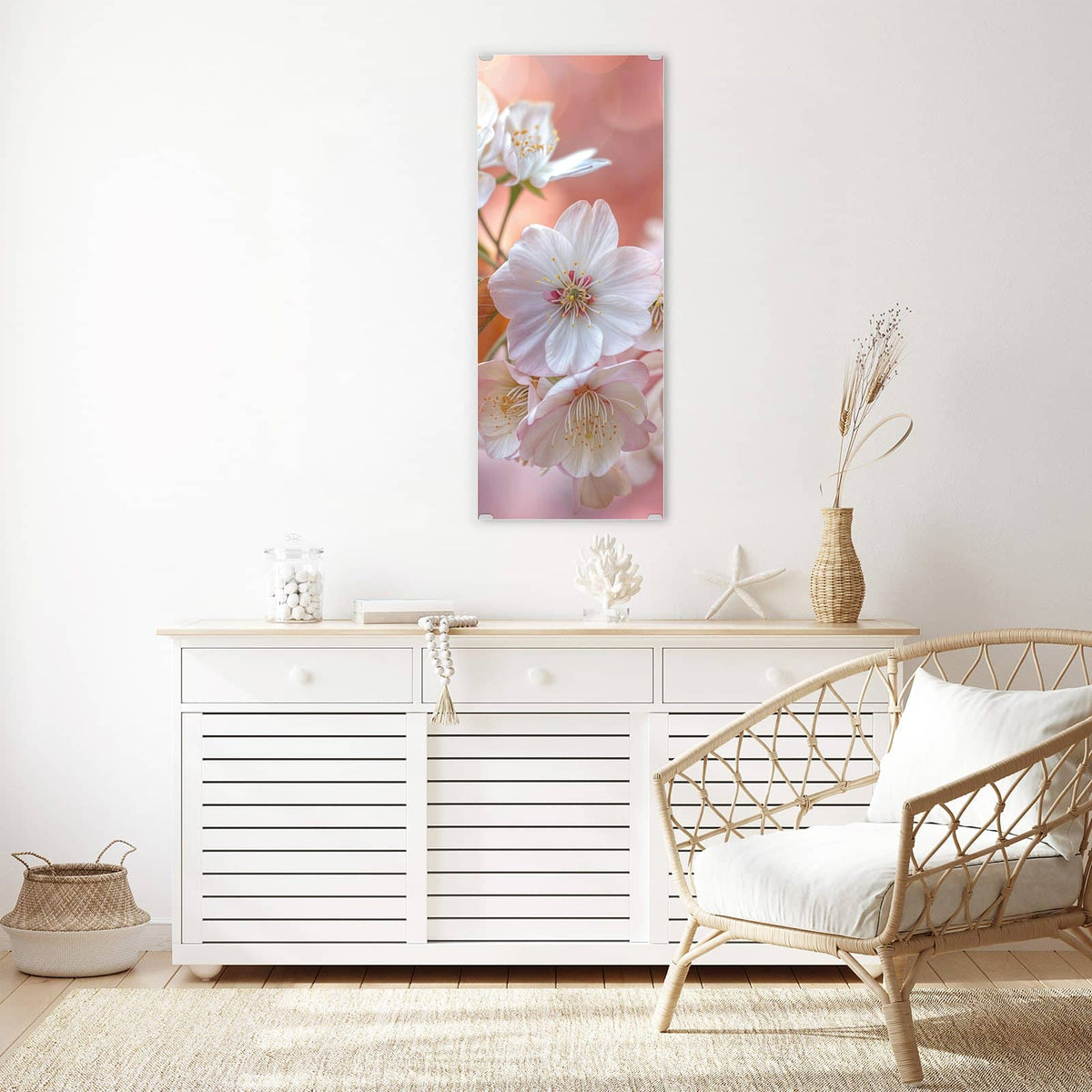 Glasbild Blüten mit Bronzelaub an der Wand – Weiße Kirschblüten mit bronzefarbenen jungen Blättern vor pfirsichfarbenem Bokeh.