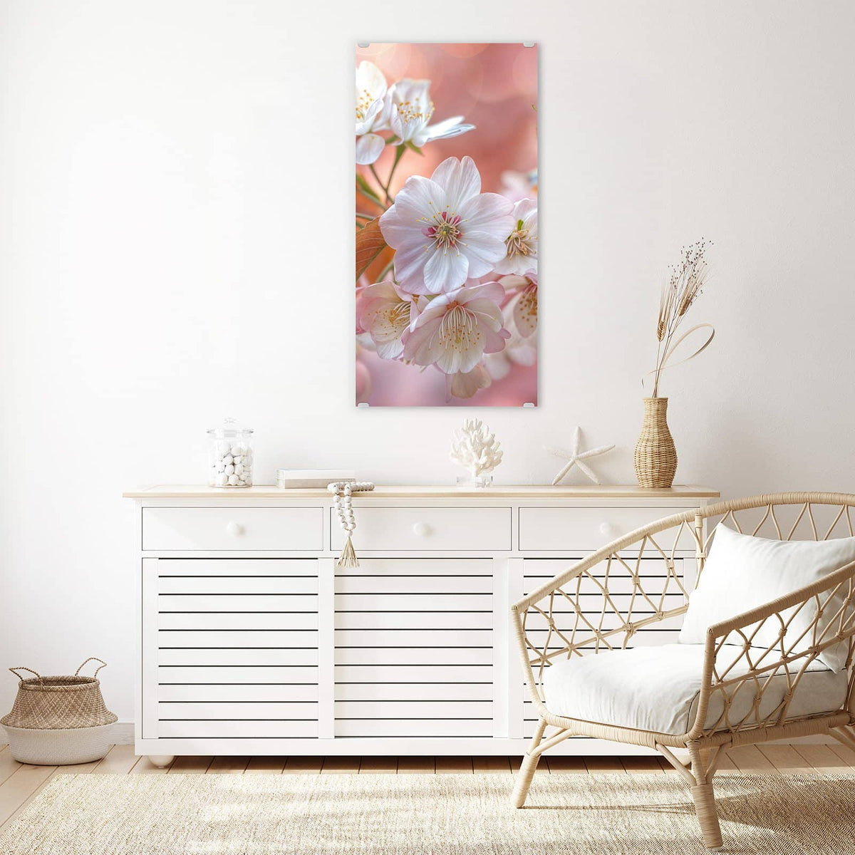 Glasbild Blüten mit Bronzelaub an der Wand – Weiße Kirschblüten mit bronzefarbenen jungen Blättern vor pfirsichfarbenem Bokeh.