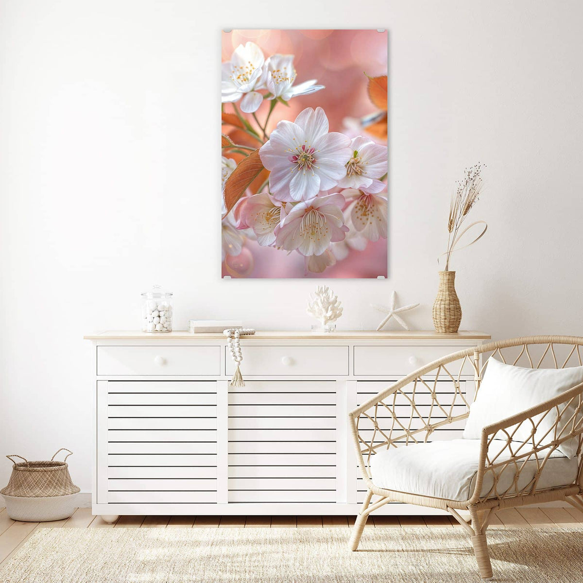 Glasbild Blüten mit Bronzelaub an der Wand – Weiße Kirschblüten mit bronzefarbenen jungen Blättern vor pfirsichfarbenem Bokeh.