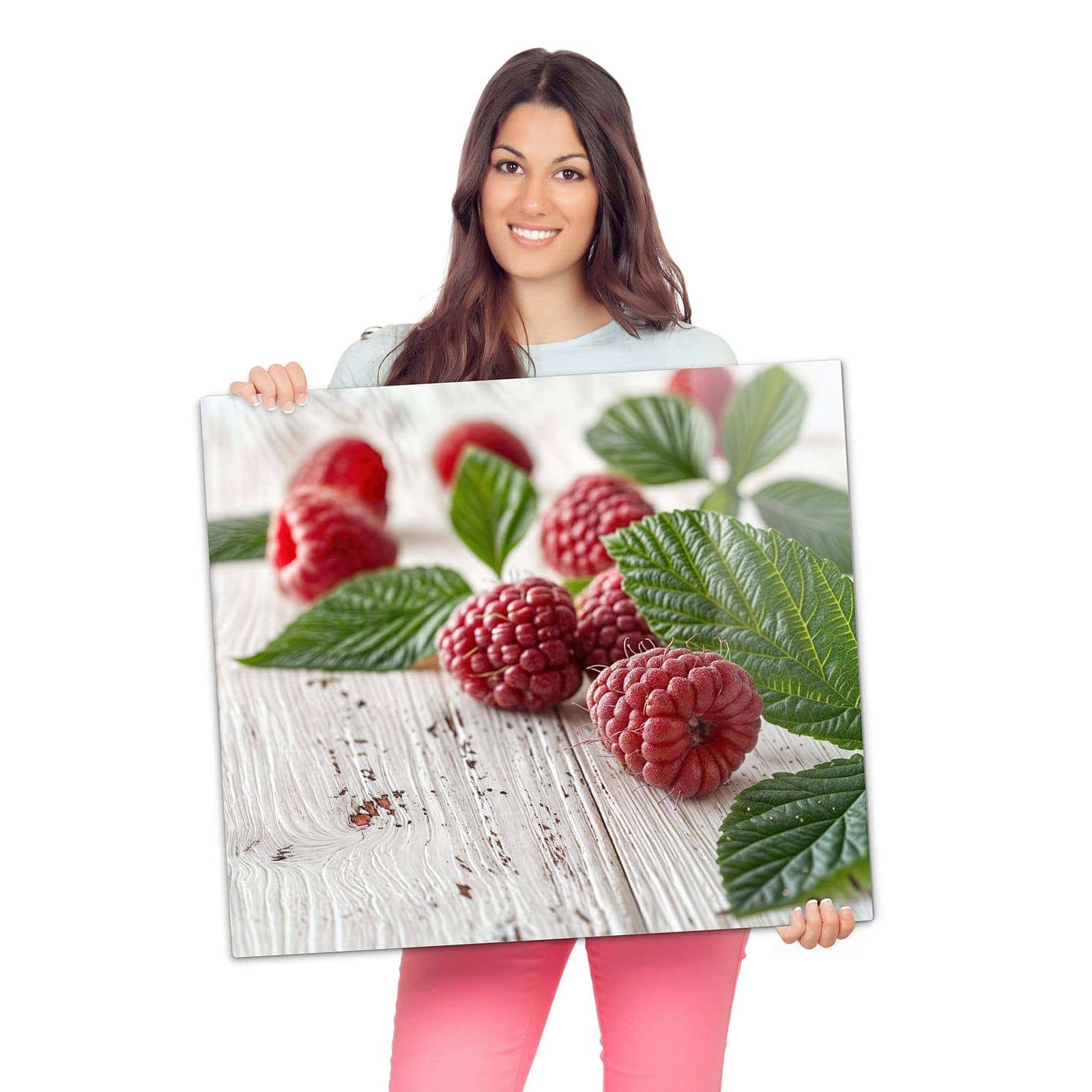 Abdeckung für Herdplatten mit Himbeeren Holztisch-Motiv wird zur Größendarstellung gehalten