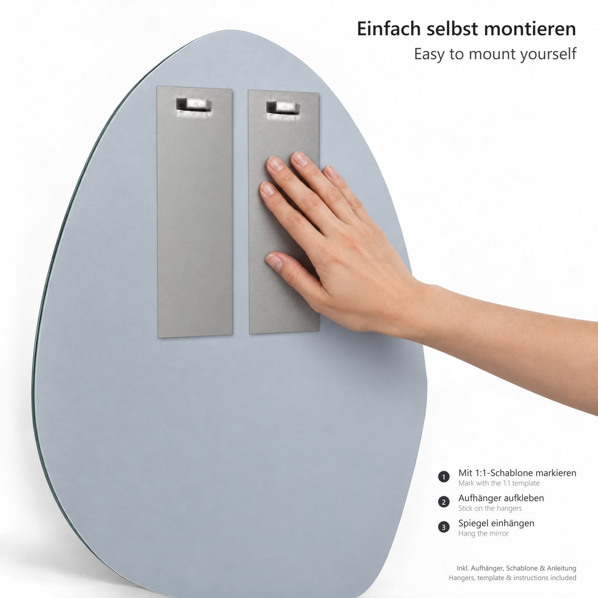 Organischer Wandspiegel Kiesel 45 × 60 cm – Montageset mit Aufhängeblechen, Klebestreifen und Bohrschablone im Maßstab 1:1