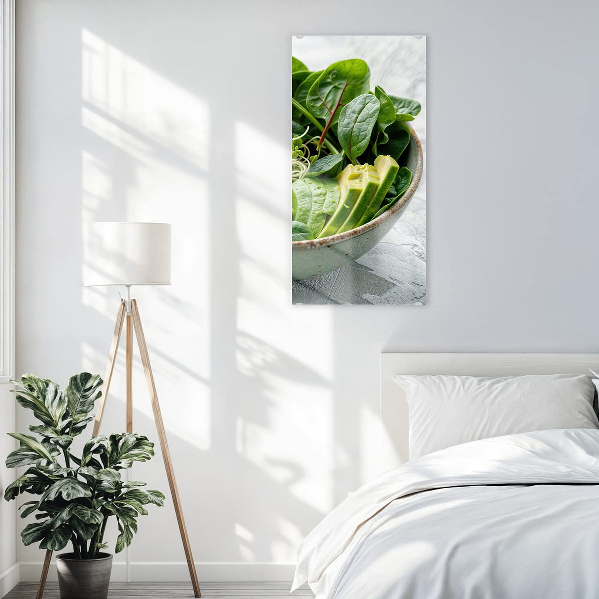 Glasbild Salat mit Avocado an der Wand – Grüne Schale mit Spinat, Gurke, Edamame, Radieschen und Sprossen, halbe Avocado und Limette daneben