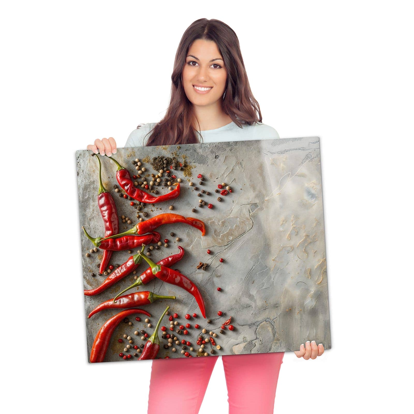 Ceranfeld Abdeckplatten mit Chili Schoten-Motiv werden zur Größendarstellung gehalten