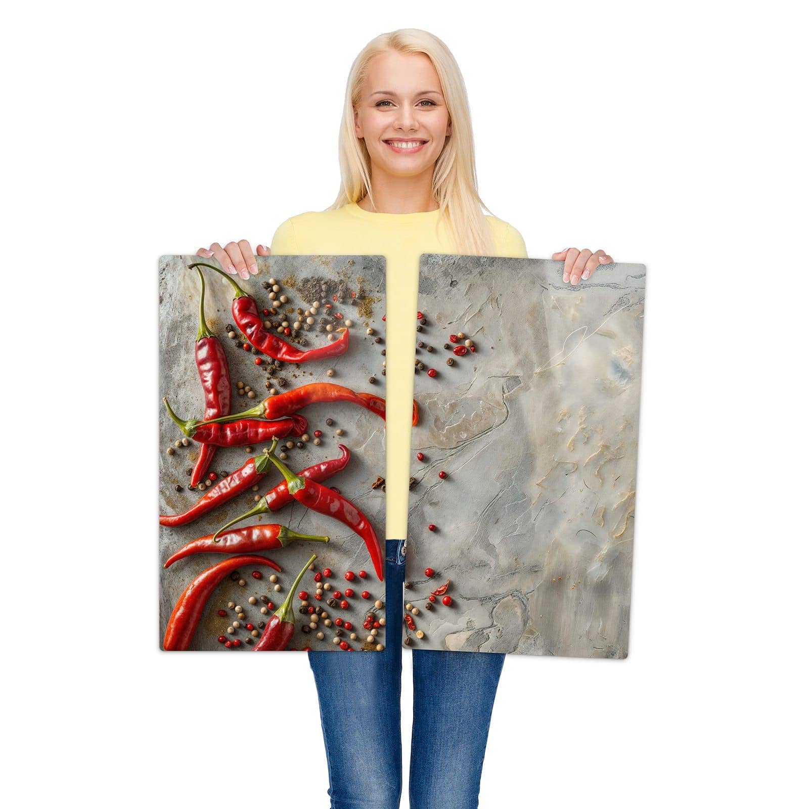 2-teilige Herdabdeckplatte mit Chili Schoten-Motiv wird zur Größendarstellung gehalten
