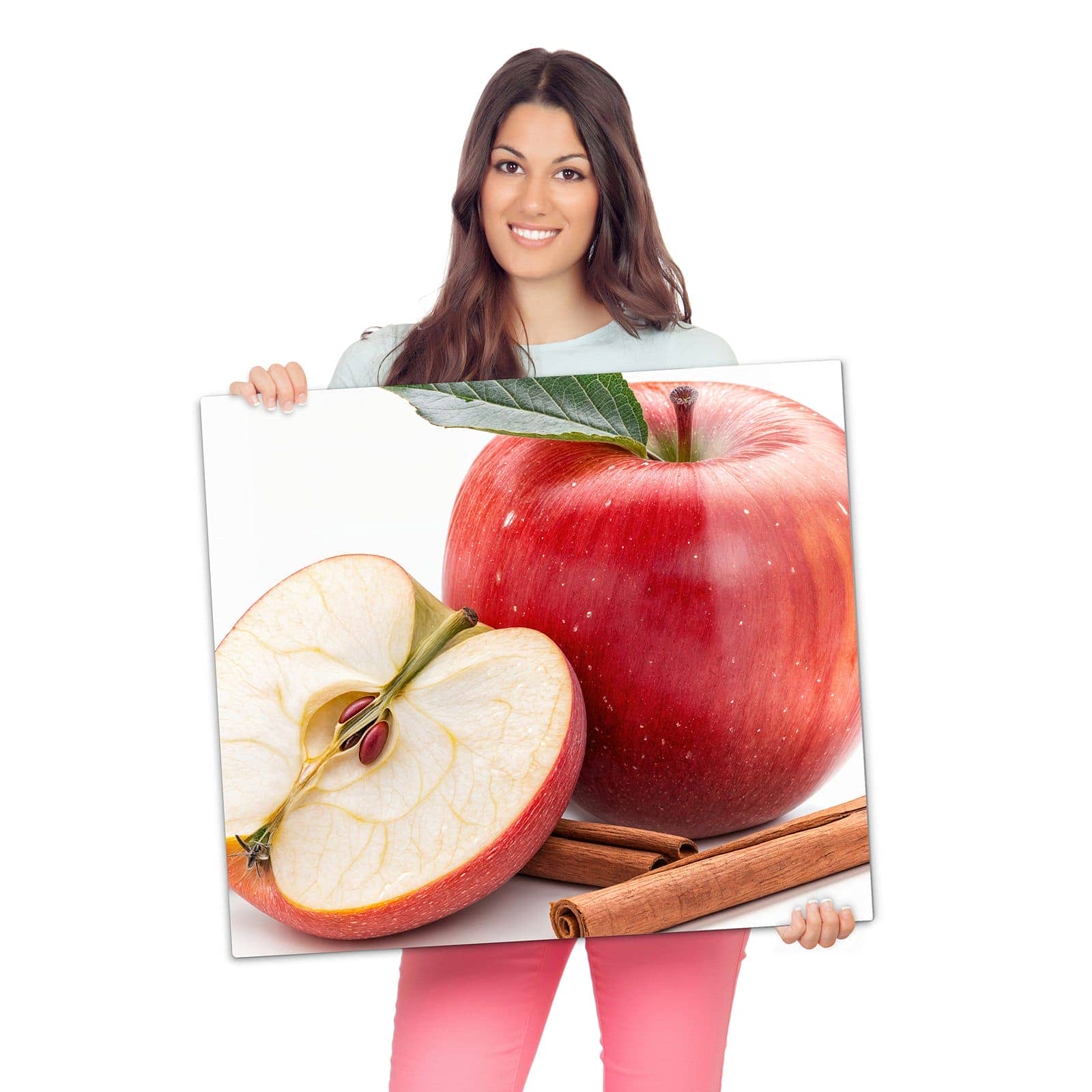 Herdabdeckplatte mit Apfel mit Zimt-Motiv wird zur Größendarstellung gehalten