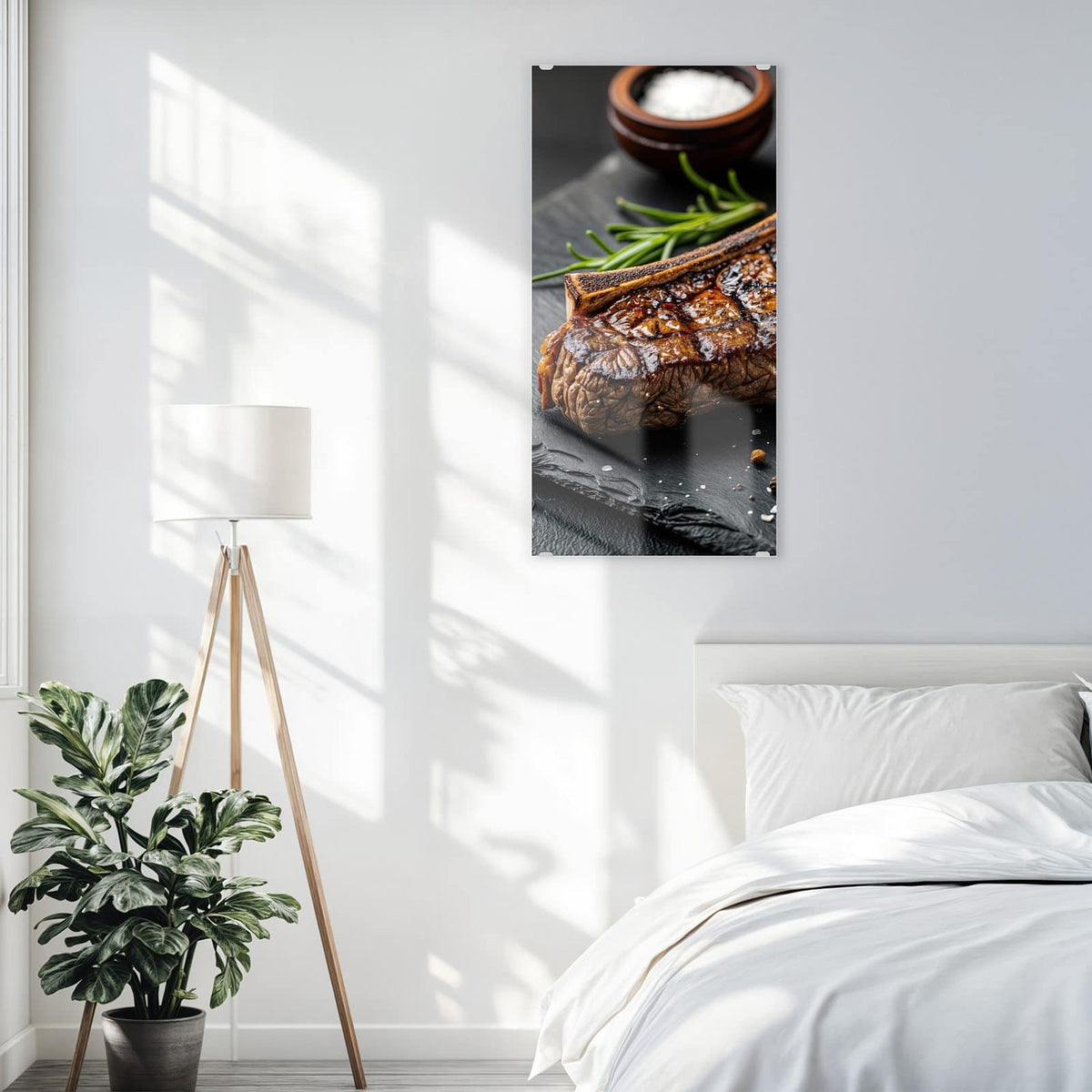 Glasbild T-Bone-Steak vom Grill an der Wand – Angeschnittenes T-Bone-Steak mit Grillstreifen auf Schiefer, dazu Rosmarin, Salzschale und Pfefferkörner