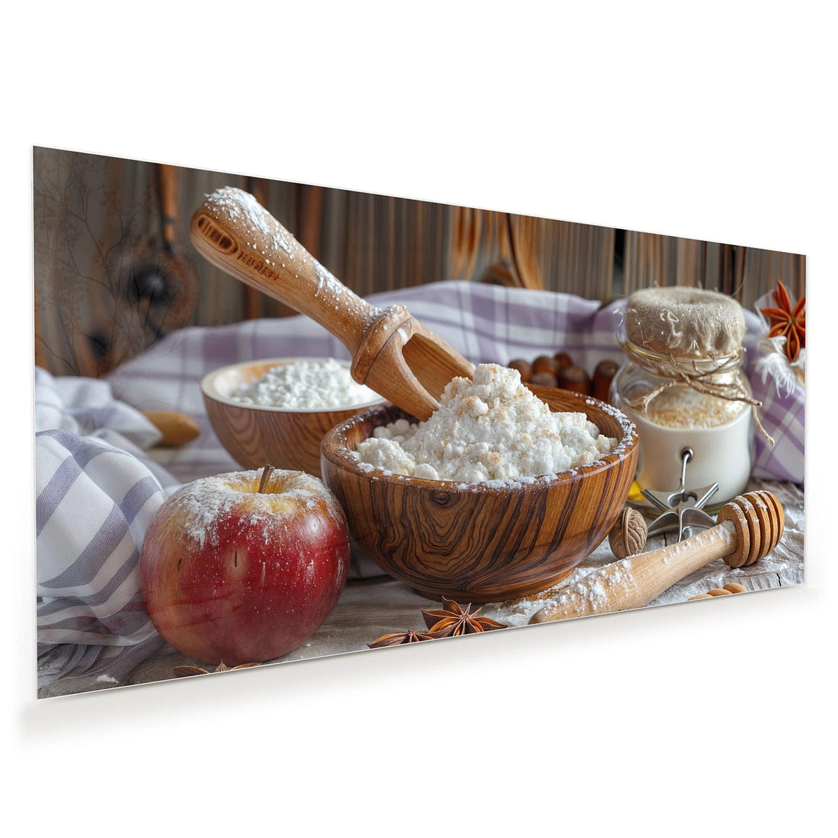 Holzschale mit Mehl, Nudelholz, roter Apfel, Sternanis und Vorratsgläser auf Holztisch