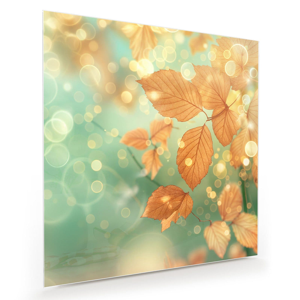 goldbraune Herbstblätter vor mintgrün-türkisem Bokeh