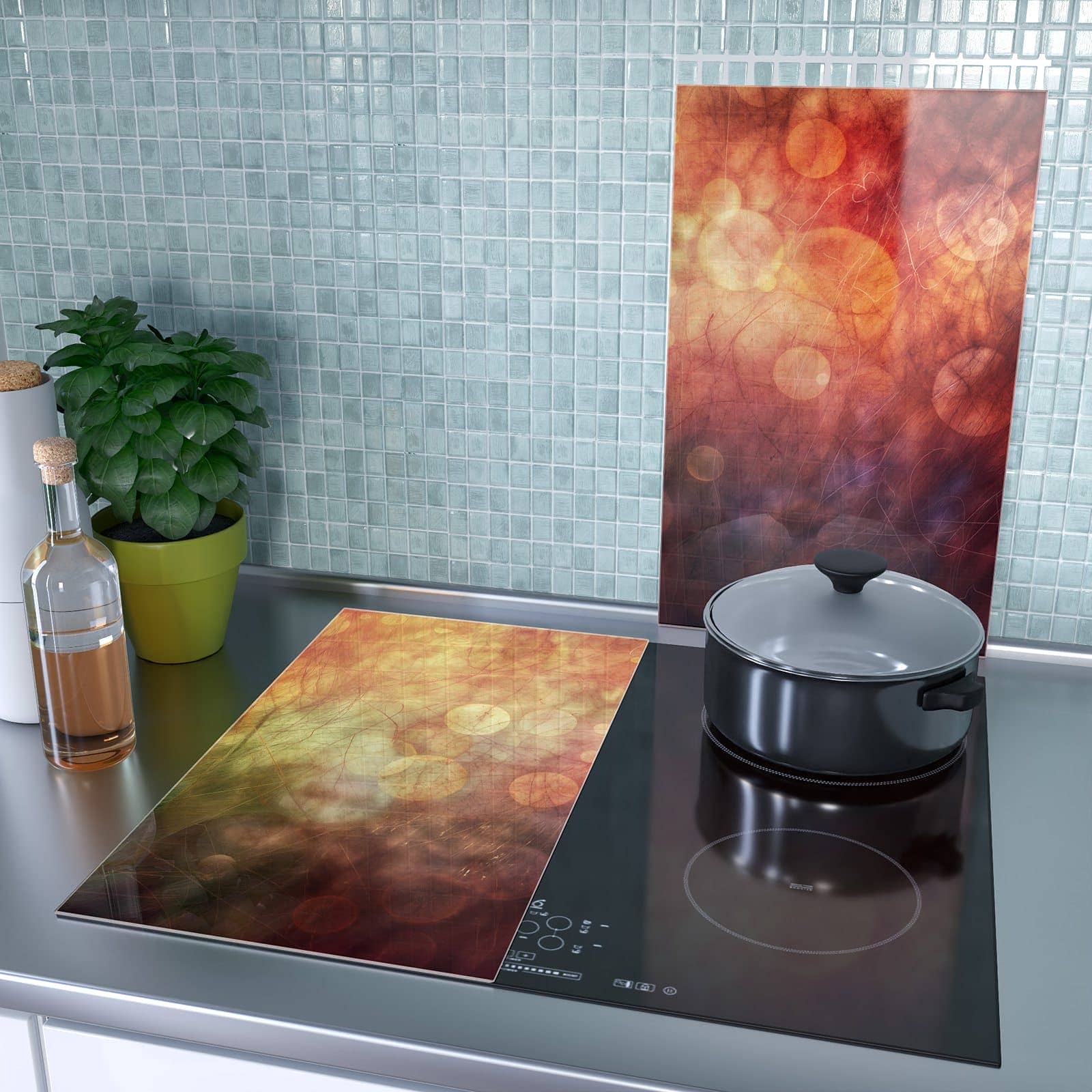 2-teilige Herdabdeckplatte aus Glas mit Abstrakte Kreise-Motiv als Spritzschutz hinter dem Kochfeld