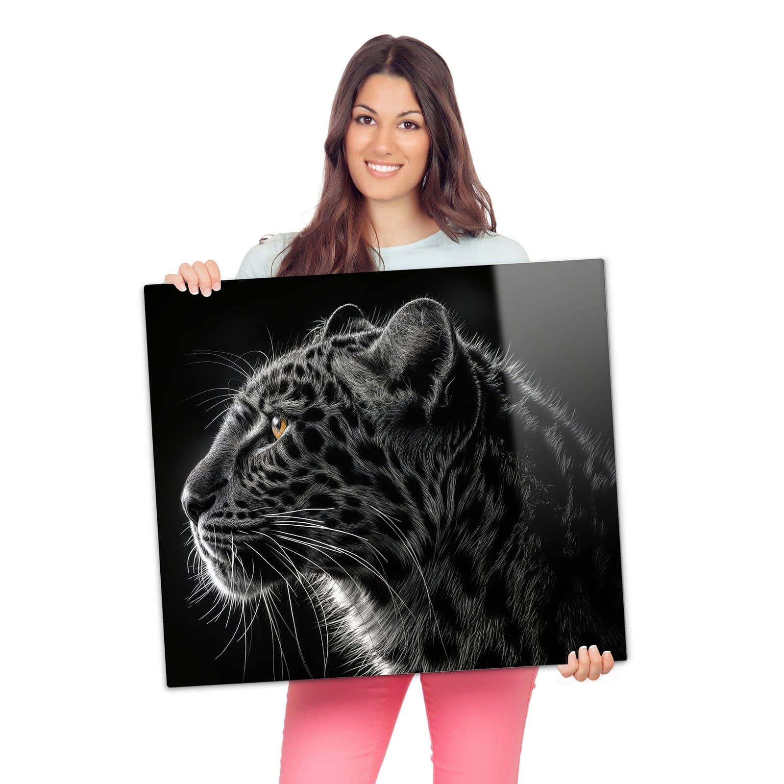 Glasplatte Herd mit Leopard Silhouette-Motiv wird zur Größendarstellung gehalten