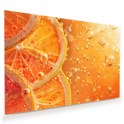 Wandbild mit dem Motiv Orangen im Sprudel
