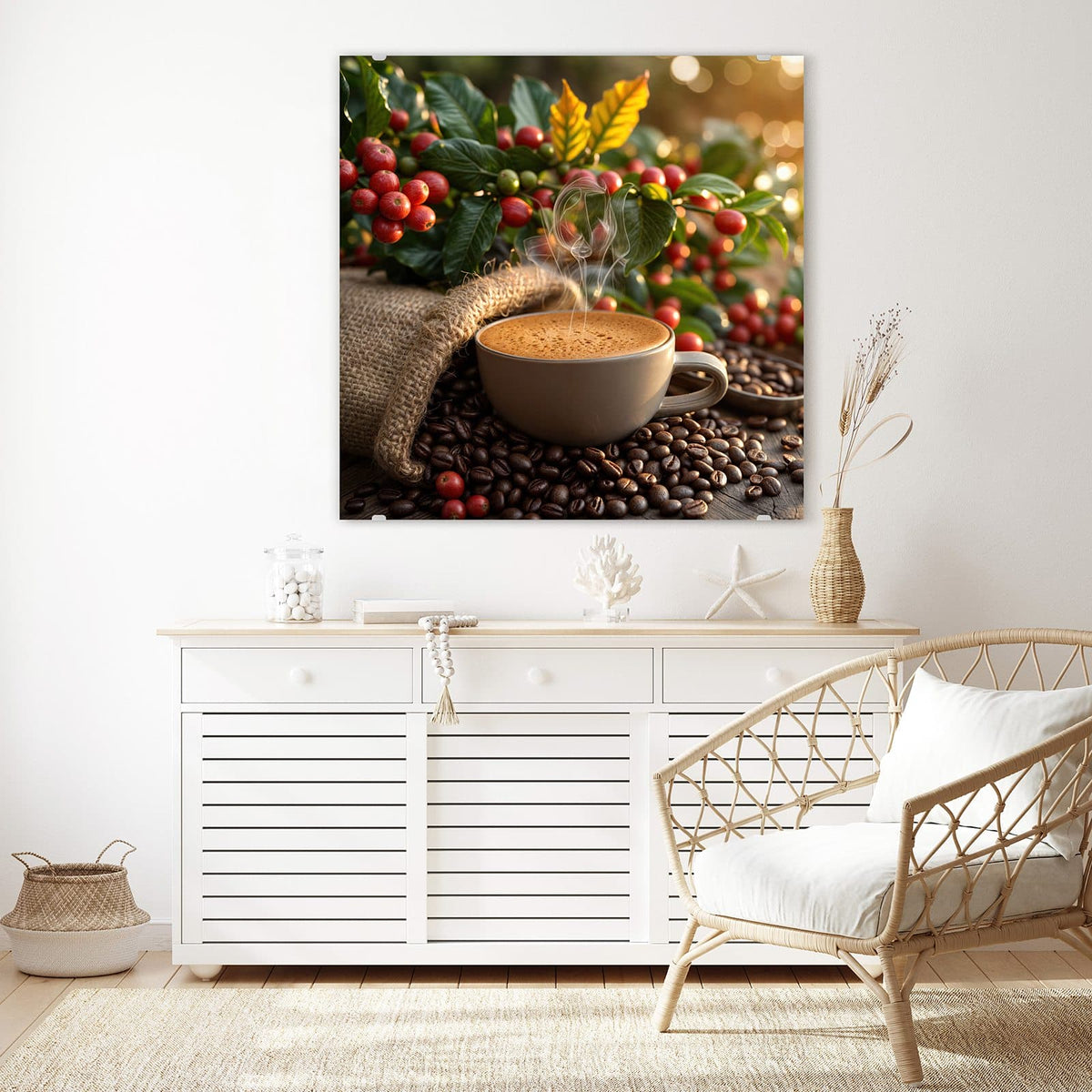 Glasbild Tasse mit Kaffeekirschen an der Wand – Dampfende Tasse Cappuccino vor Zweigen mit roten Kaffeekirschen, Jutesack und Bohnenhaufen