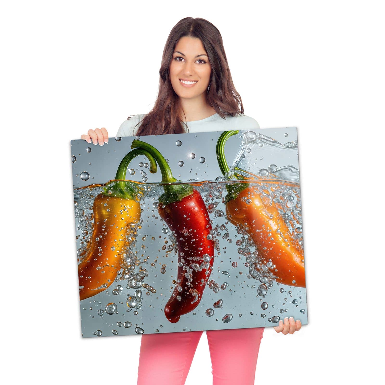 Herdabdeckplatte mit Spritzige Paprika-Motiv wird zur Größendarstellung gehalten