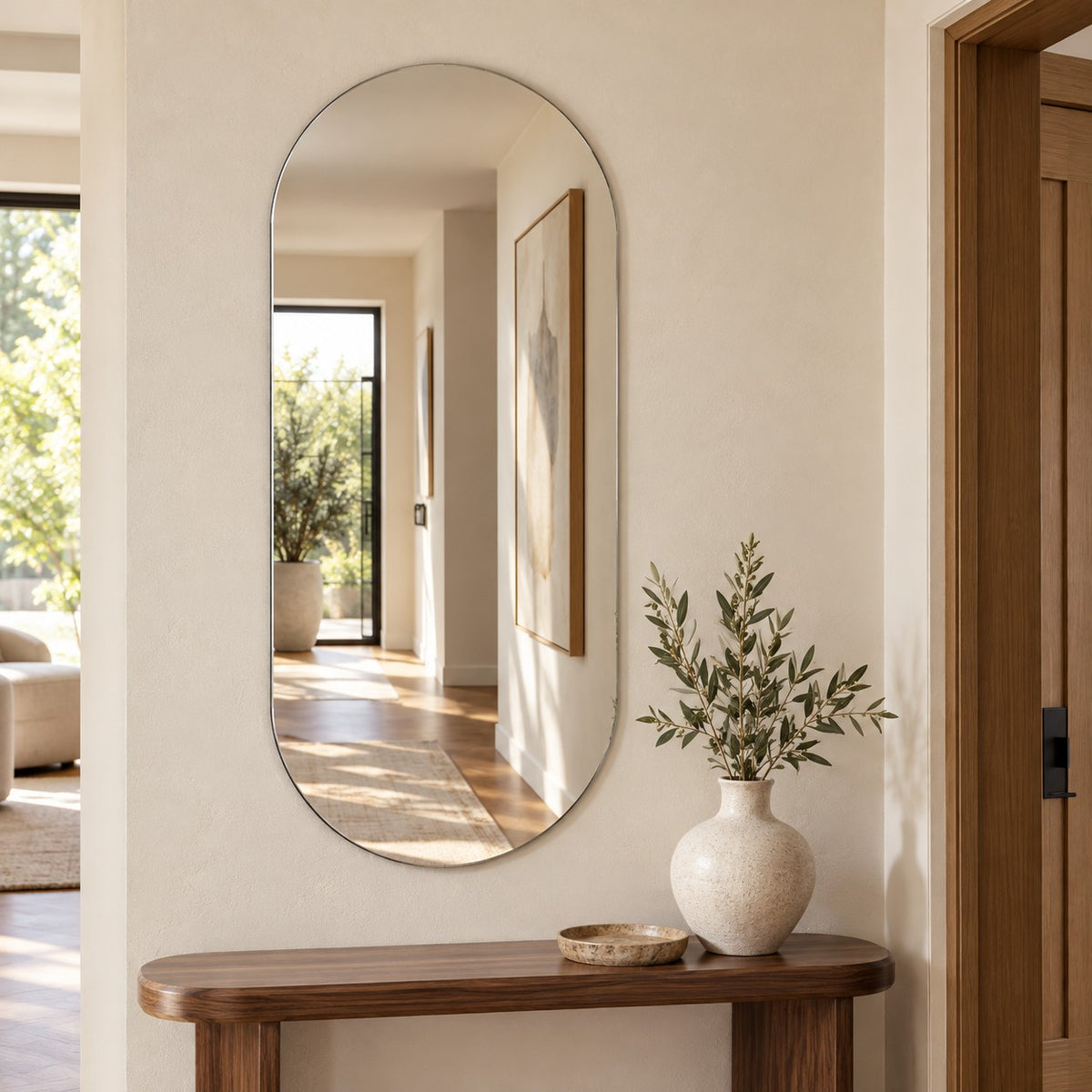 Ovaler Wandspiegel Lago 40 × 80 cm, rahmenlos, im Flur über einer Konsole #grösse_40 x 80 cm
